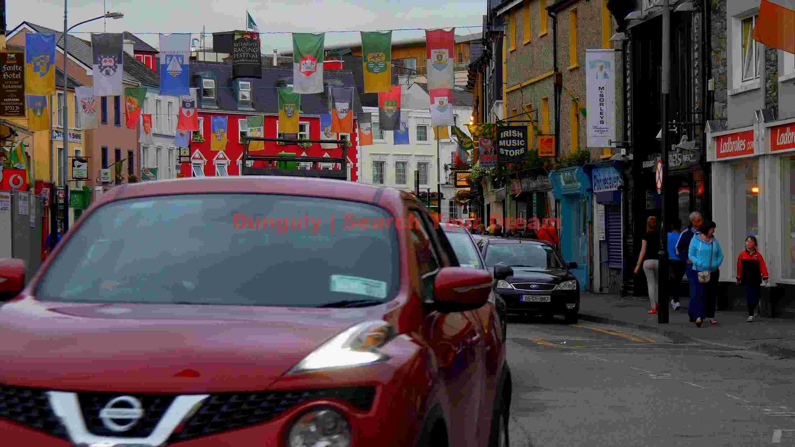 vibrant irish town street with festive banners vibrant irish town street with festive banners