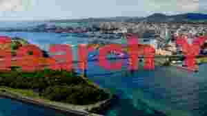 vibrant okinawa coastal cityscape with blue arch bridge