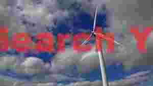 At Home wind turbine against dynamic sky