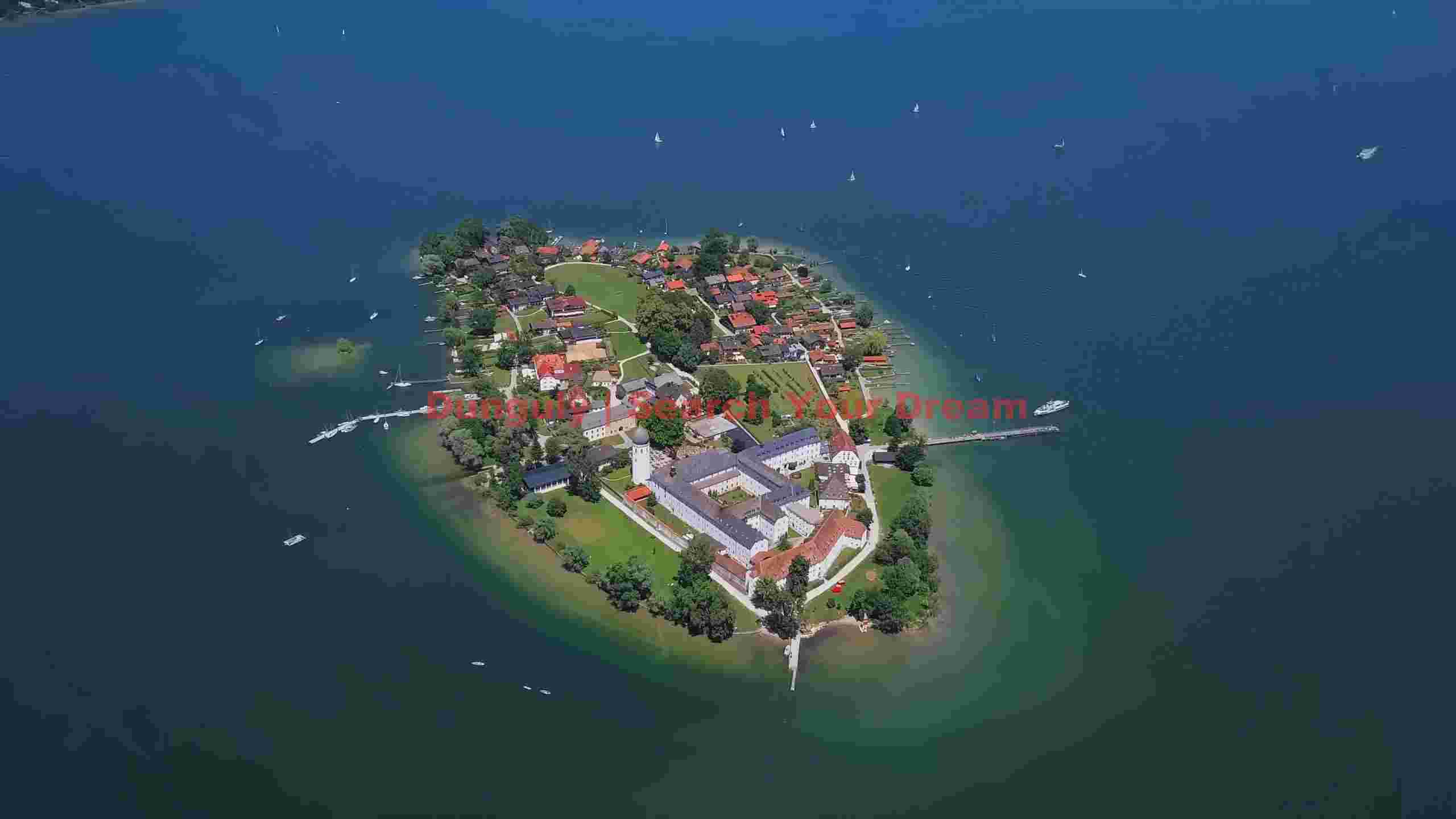 aerial view of historic island village and monastery on lake aerial view of historic island village and monastery on lake