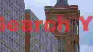 architectural contrast modern building and historic clock tower