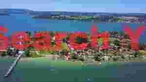 At Home bavarian lakeside village and monastery aerial view