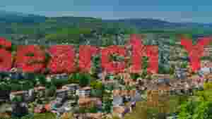 charming european village nestled among lush green hills
