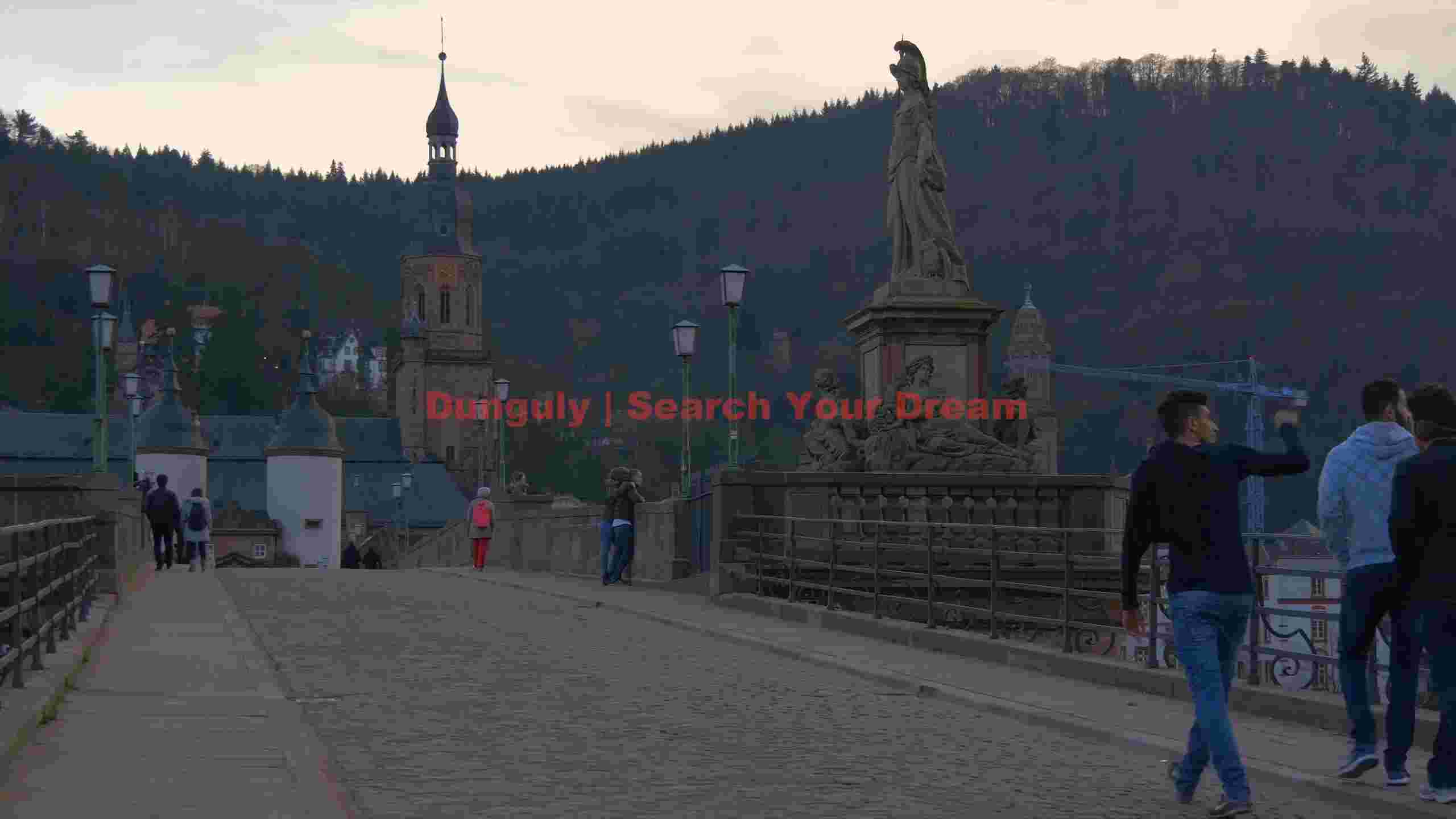 evening walk on heidelbergs historic old bridge evening walk on heidelbergs historic old bridge