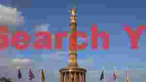 golden victory column against a blue sky