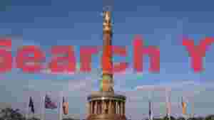 golden victory column under a blue sky