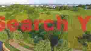At Home lush green hillside with winding paths