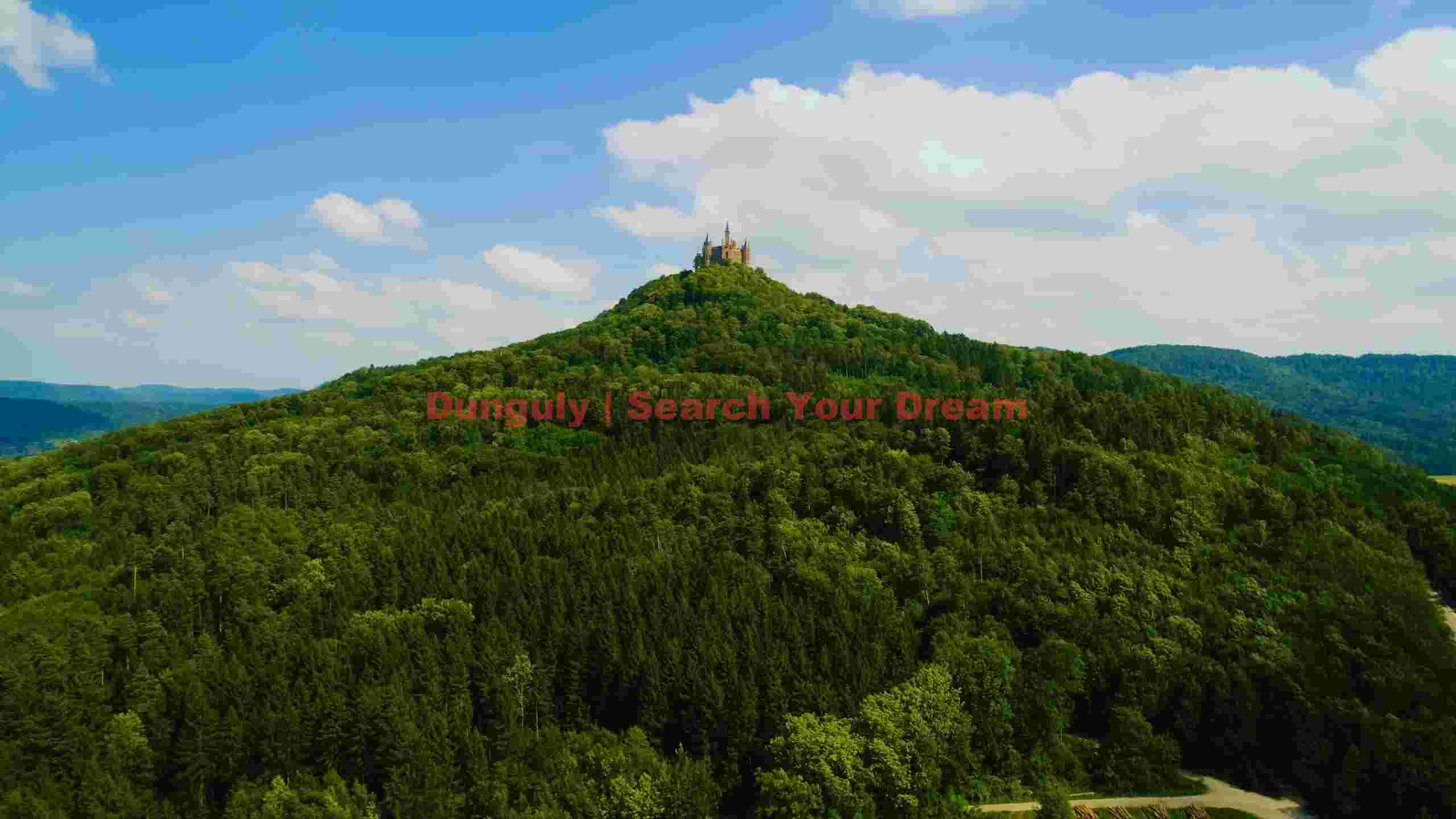 majestic castle on lush forested peak majestic castle on lush forested peak
