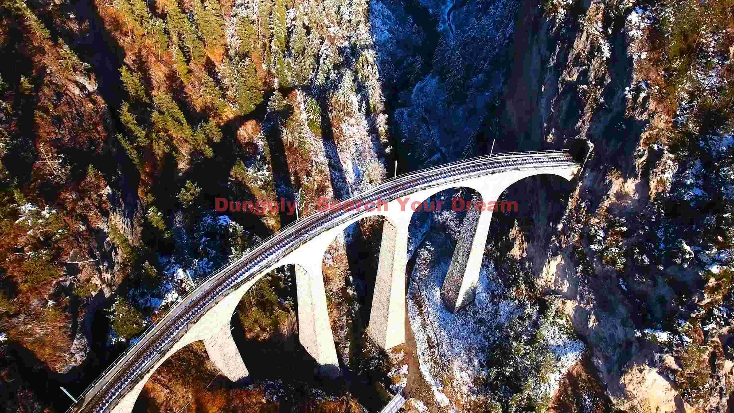 majestic railway viaduct in snowy mountains majestic railway viaduct in snowy mountains