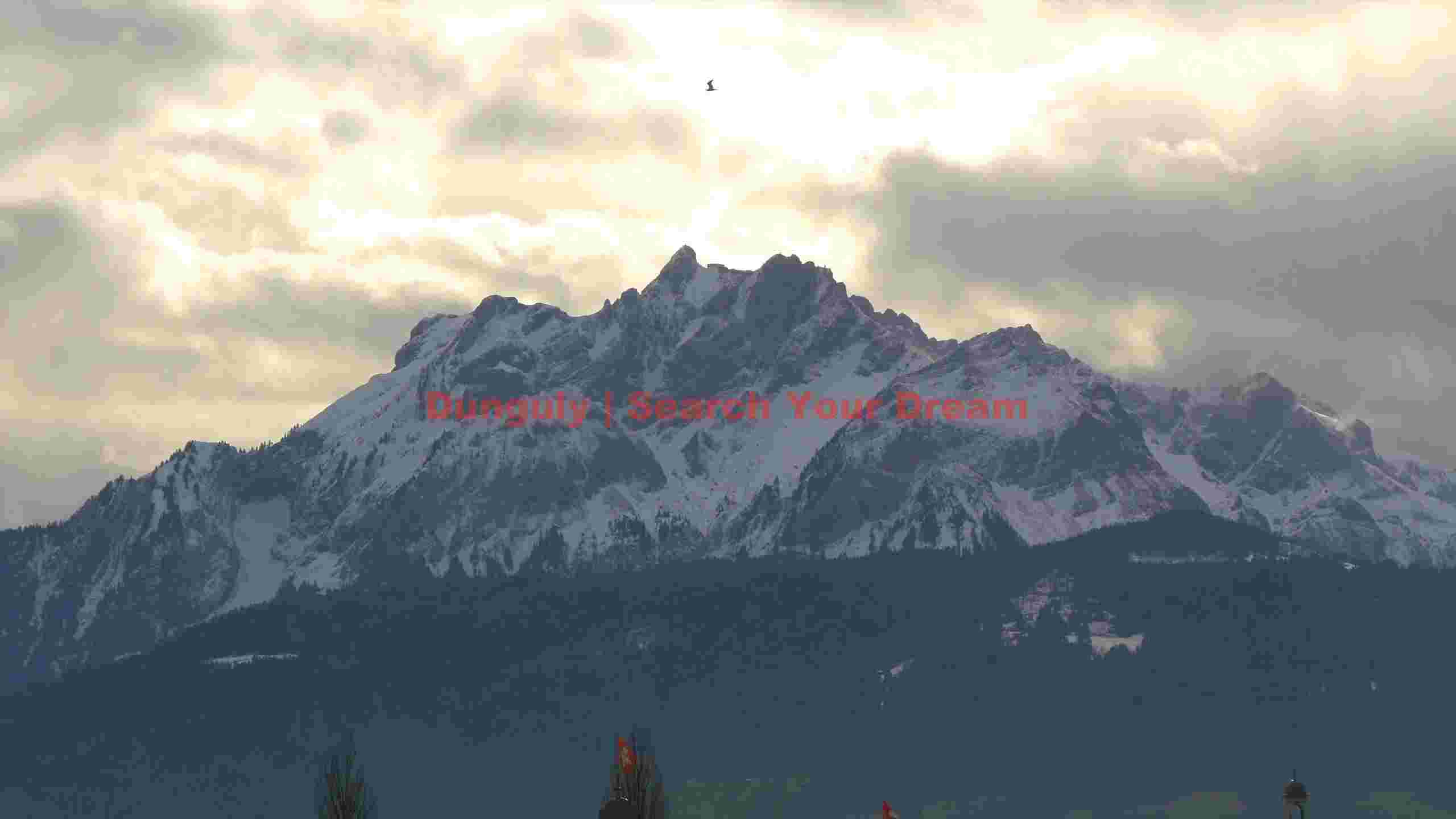 majestic snow capped alps under overcast sky majestic snow capped alps under overcast sky