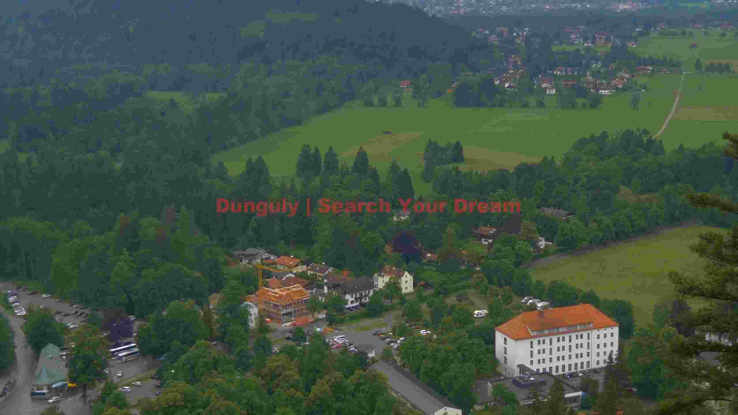 panoramic alpine valley with forest and village panoramic alpine valley with forest and village