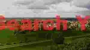 panoramic view of historic village and lush countryside