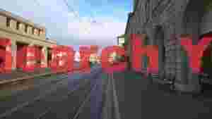 riverside tram lines in historic european city