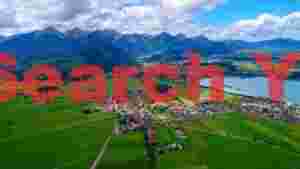At Home scenic alpine village and lake vista